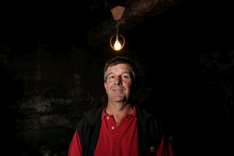Eric Rousseau - Domaine Armand Rousseau. Eric says that he gets all his bright ideas when he works in his cellar. Here he stands in his cellar with a star-bursting bulb above his head depicting one of those moments.